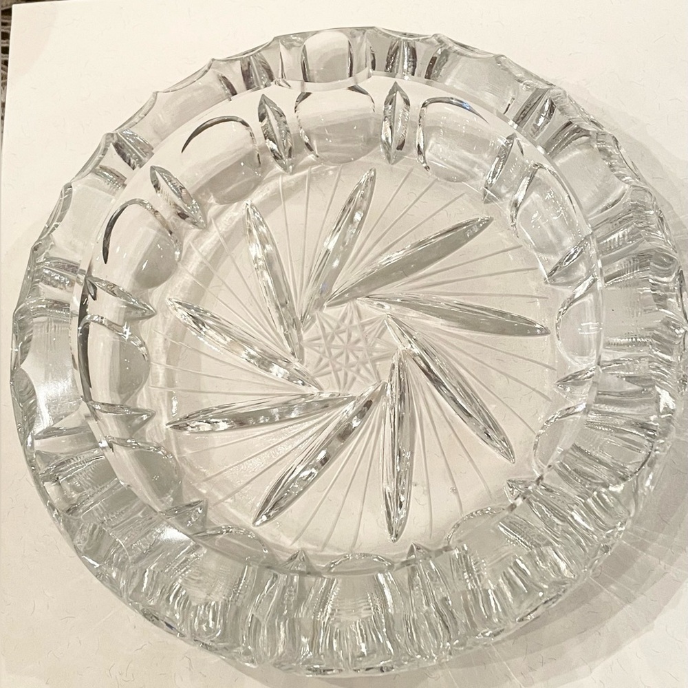 Beautiful, clear,cut glass ashtray / decor item with star and swirl design.